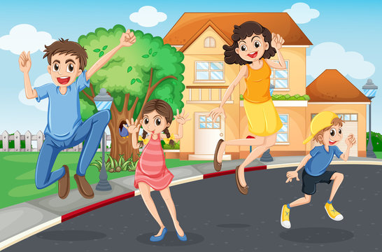 A happy family jumping in the street