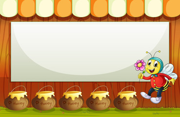 An empty signboard above the pot of honeys