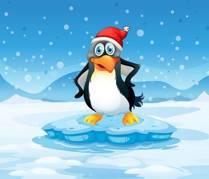 A penguin wearing Santa's hat standing above an iceberg