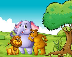 An elephant, a lion and a bear near the tree