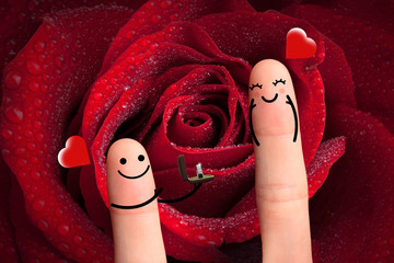 Will you marry me? Couple with diamond ring and big red rose