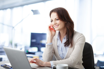 Beautiful business woman with laptop