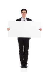 Young male office worker standing with placard.