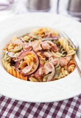 Fusilli pasta with bacon and onion