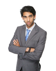 Young business man standing with arms crossed