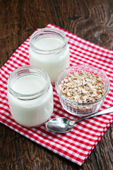 Jars of fresh yogurt and oatsmeal