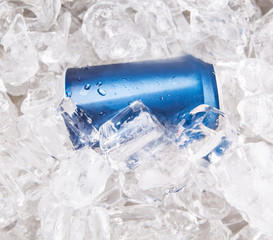 A can of cola drinks with ice cubes