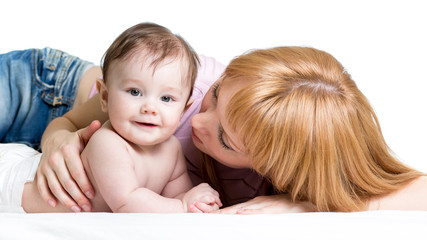 mother playing with baby girl isolated on white