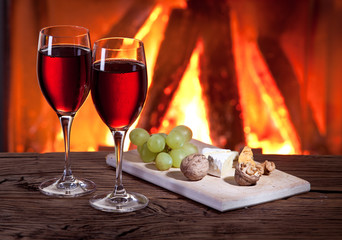 Glasses of wine, cheese and nuts.