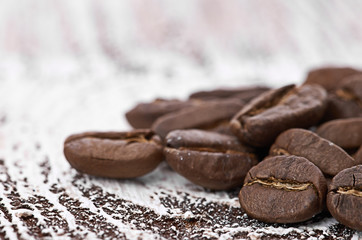 Coffee beans on wood background