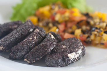 Pork Tenderloin in Poppy Seeds with olive salsa
