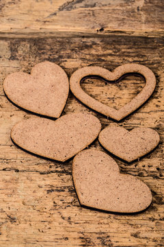 wooden hearts on wooden background