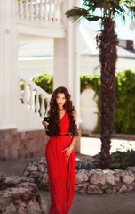 Sexy young beauty woman in red dress