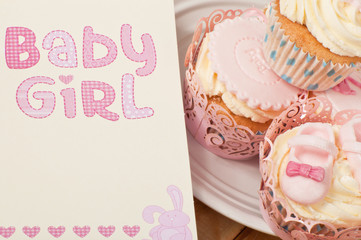 Baby girl celebration card and cupcakes