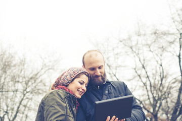 couple in love using tablet connecting web wireless wifi