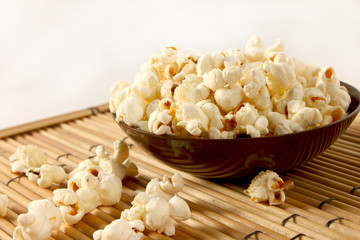 Fototapeta na wymiar popcorn over filled in bowl