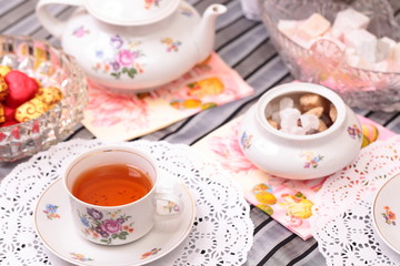 Warm cup of tea and sweets