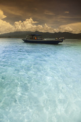 Boat on the blue lagoon of Gili Air, Indonesia 