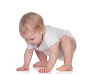 Adorable blonde baby in underwear crawling