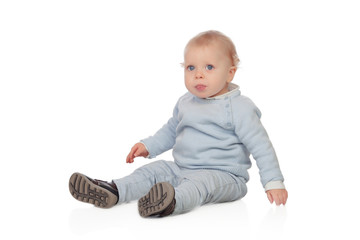 Naklejka premium Adorable blonde baby sit on the floor