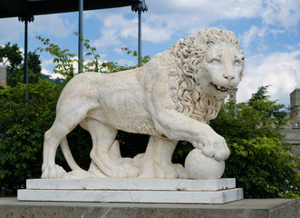 Lion statue outside a castle
