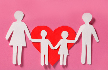 Paper Family and Red Heart over pink background. Love, Kids