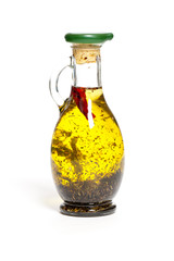 Olive oil with herbs in a bottle
