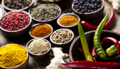 Spices on wooden bowl background 