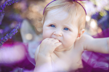 Portrait of an adorable smiling girl in lavender field