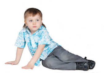 Little boy sitting on the floor