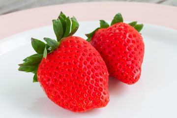 strawberries on white plate