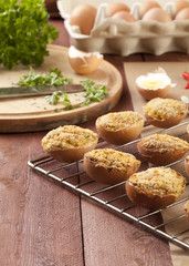 Baked eggs, stuffed with ham and parsley