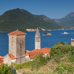Fototapeta na wymiar Ancient Churches in Perast town. Bay of Kotor, Montenegro