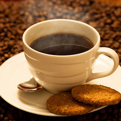 Cup of delicious black coffee on a wooden table