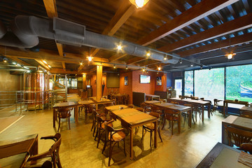 Interior of small cafe-bar with wooden furniture