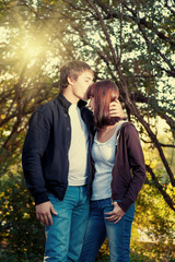 couple in love in the park on green