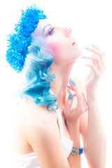 Girl with beautiful make-up and blue hair.