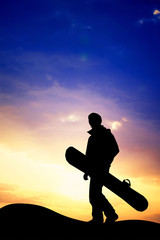 Fototapeta na wymiar snowboarder at sunset