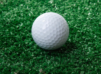 Golf ball ower green grass