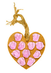 Handmade wooden heart decorated with paper roses on white backgr