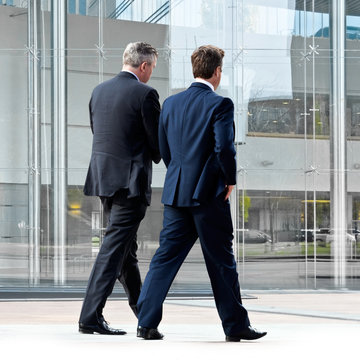 Businessmen walking on the street.