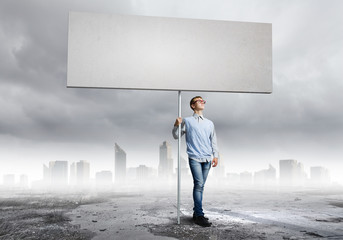 Teenager with banner