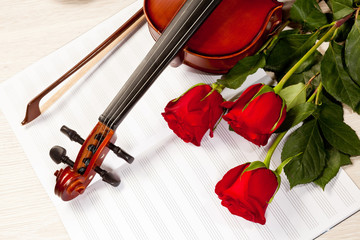 Fototapeta premium Red roses and a violin