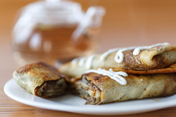 pancakes stuffed with mushrooms and cabbage