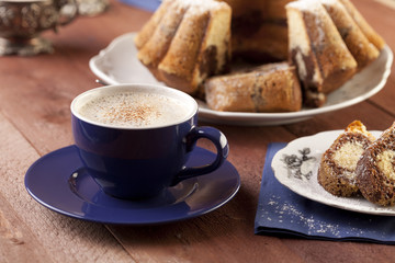 Cap of coffee with marable cake