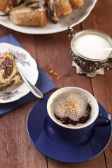 Cap of coffee with marable cake