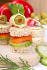 finger foods: bread, peppers, cucumber, cheese and olives