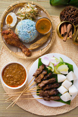 Nasi kerabu or nasi ulam, popular Malay rice dish. Blue color of