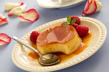 Creme caramel with raspberries.