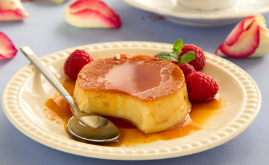 Creme caramel with raspberries.